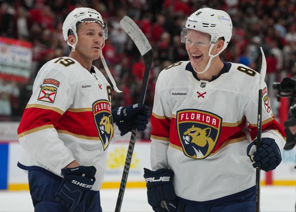 Sep 29, 2026; Raleigh, North Carolina, USA;  Florida Panthers left wing Matthew Tkachuk (19) and left wing Brady Tkachuk (8) celebrate after defeating the Carolina Hurricanes in overtime at Lenovo Center.  Mandatory Credit: James Guillory-Imagn Images