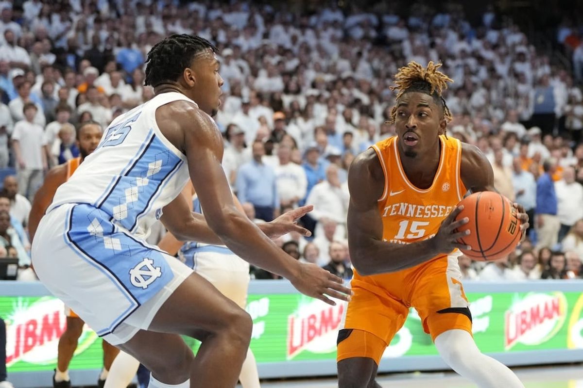 Nov 29, 2023; Chapel Hill, North Carolina, USA; Tennessee Volunteers guard Jahmai Mashack (15) looks to pass as North Carolina Tar Heels forward Harrison Ingram (55) defends in the first half at Dean E. Smith Center.