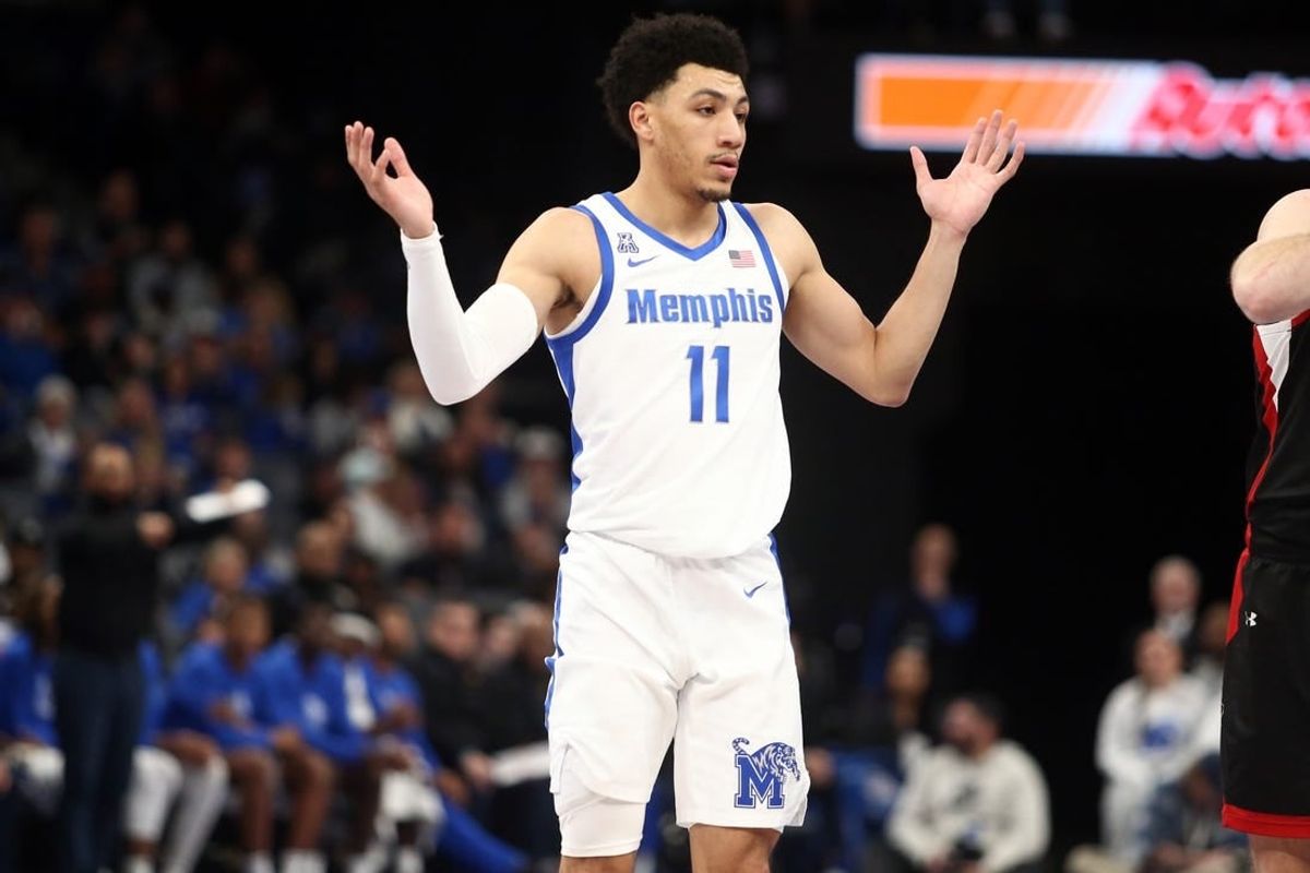 Dec 30, 2023; Memphis, Tennessee, USA; Memphis Tigers guard Jahvon Quinerly (11) reacts during the second half against the Austin Peay Governors at FedExForum.
