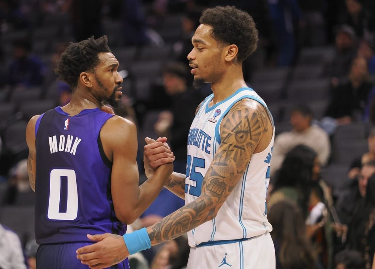 Jan 2, 2024; Sacramento, California, USA; Sacramento Kings guard Malik Monk (0) and Charlotte Hornets forward P.J. Washington Jr. (25) shake hands after the game at Golden 1 Center.