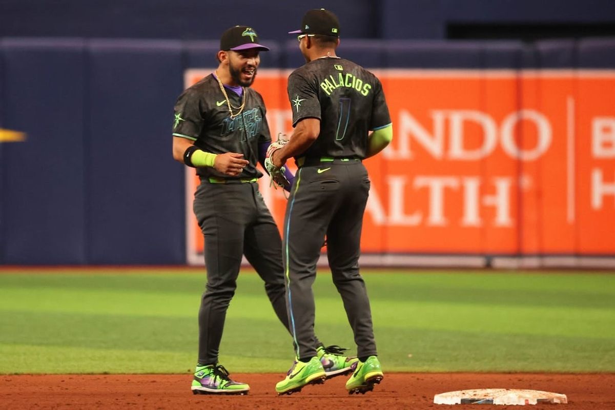 May 4, 2024; St. Petersburg, Florida, USA;  Tampa Bay Rays shortstop Jose Caballero (7) and outfielder Richie Palacios (1) celebrates after they beat the New York Mets at Tropicana Field.
