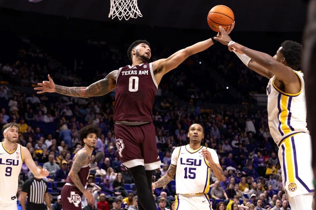 Jan 20, 2024; Baton Rouge, Louisiana, USA;  LSU Tigers guard Jordan Wright (6) knocks the rebound away from Texas A&M Aggies guard Jace Carter (0) during the second half at Pete Maravich Assembly Center.