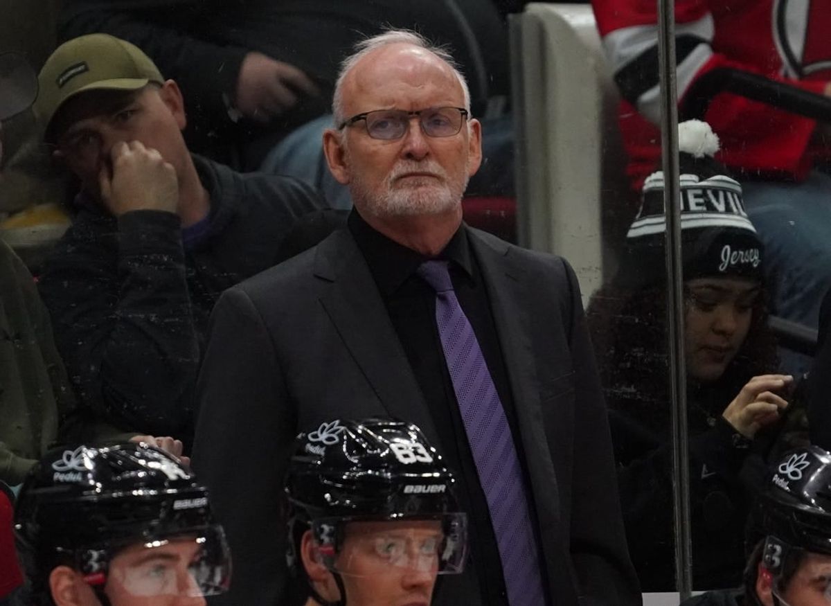 Feb 10, 2024; Raleigh, North Carolina, USA; New Jersey Devils head head Lindy Ruff looks on form. Behind the players bench against the Carolina Hurricanes during the second period at PNC Arena.