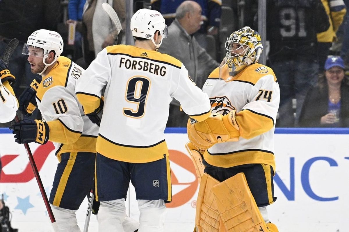 Feb 17, 2024; St. Louis, Missouri, USA; Nashville Predators left wing Filip Forsberg (9) congratulates goaltender Juuse Saros (74) after defeating the St. Louis Blues at Enterprise Center.