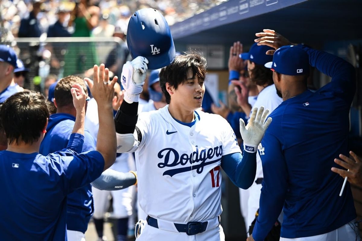 Apr 21, 2024; Los Angeles, California, USA; Los Angeles Dodgers designated hitter Shohei Ohtani (17) celebrates in the dugout with teammates after a home run against the New York Mets during the third inning at Dodger Stadium.