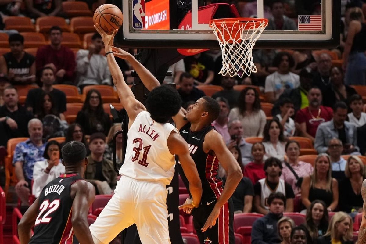 Dec 8, 2023; Miami, Florida, USA; Cleveland Cavaliers center Jarrett Allen (31) puts up a shot over Miami Heat center Orlando Robinson (25) during the first half at Kaseya Center.