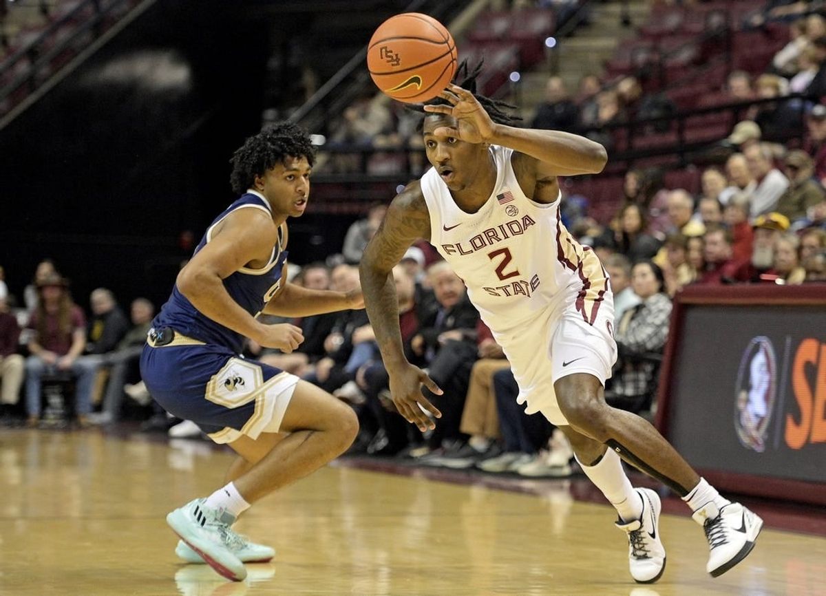 Jan 3, 2024; Tallahassee, Florida, USA; Florida State Seminoles forward Jamir Watkins (2) dribbles towards the net during the first half against the Georgia Tech Yellow Jackets at Donald L. Tucker Center.