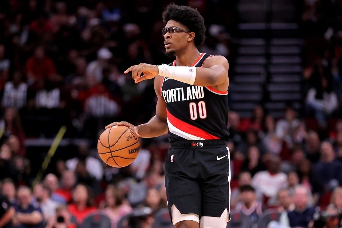 Mar 25, 2024; Houston, Texas, USA; Portland Trail Blazers guard Scoot Henderson (00) handles the ball against the Houston Rockets during the fourth quarter at Toyota Center.