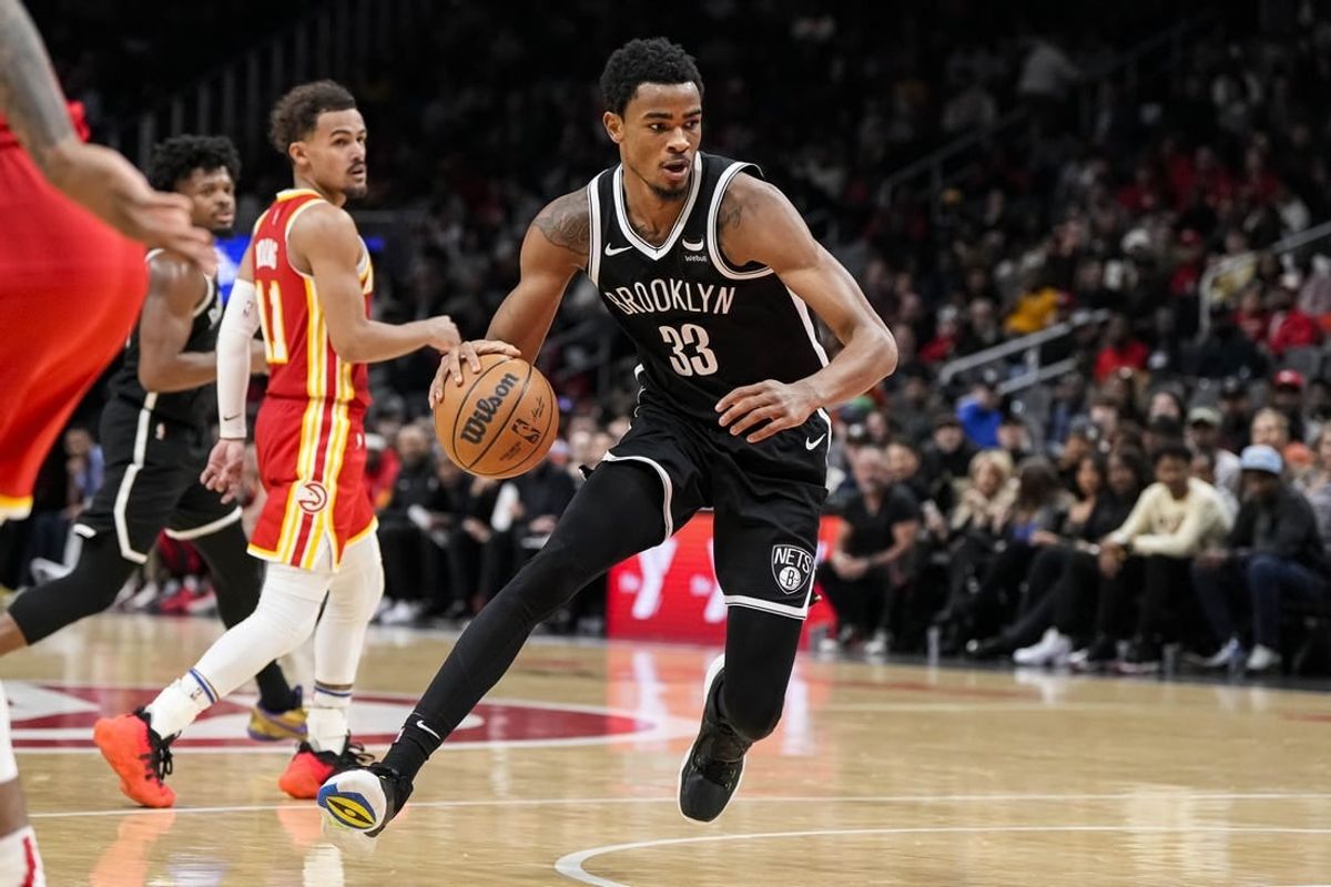 Dec 6, 2023; Atlanta, Georgia, USA; Brooklyn Nets center Nic Claxton (33) controls the ball against the Atlanta Hawks during the second half at State Farm Arena.