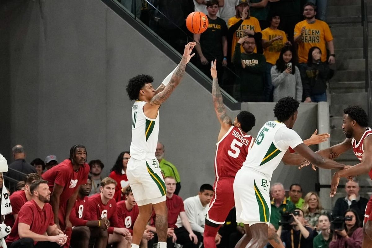 Feb 13, 2024; Waco, Texas, USA;  Baylor Bears forward Jalen Bridges (11) scores a three point basket against Oklahoma Sooners guard Rivaldo Soares (5) during the first half at Paul and Alejandra Foster Pavilion.