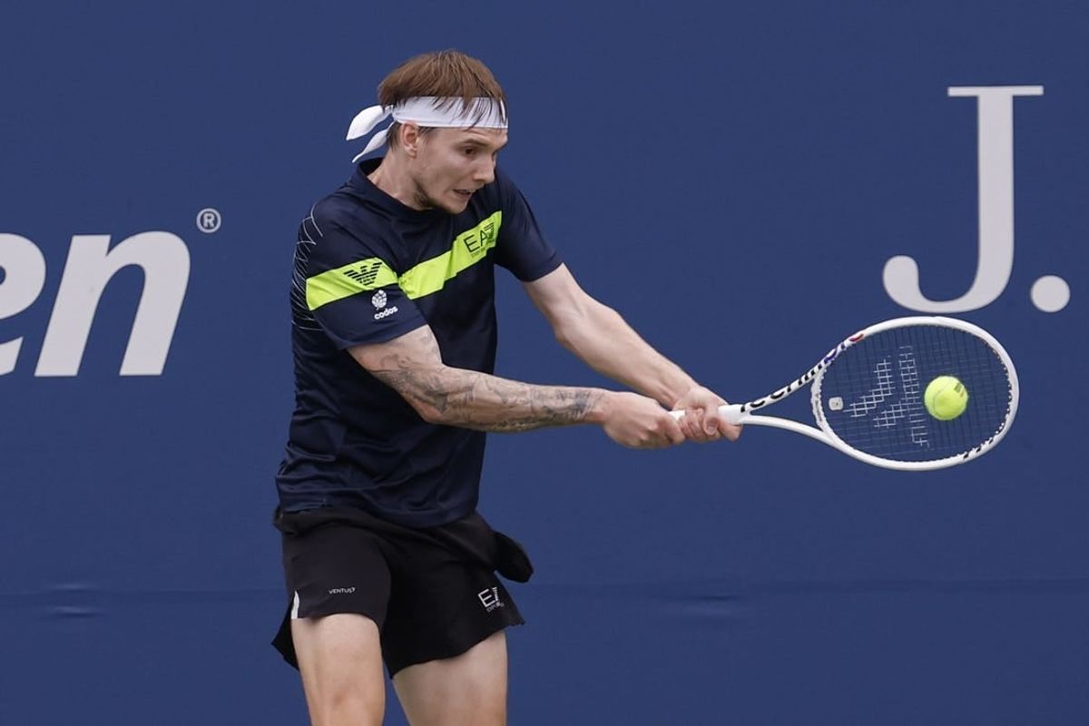 Aug 28, 2023; Flushing, NY, USA; Alexander Bublik of Kazakhstan hits a backhand against Dominic Thiem of Austria (not pictured) on day one of the 2023 US Open at the Billie Jean King National Tennis Center.