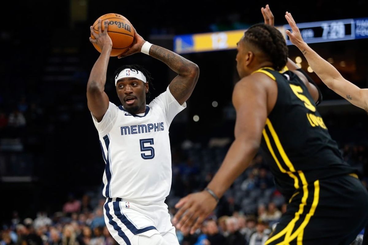 Jan 15, 2024; Memphis, Tennessee, USA; Memphis Grizzlies guard Vince Williams Jr. (5) passes the ball during the first half against the Golden State Warriors at FedExForum.
