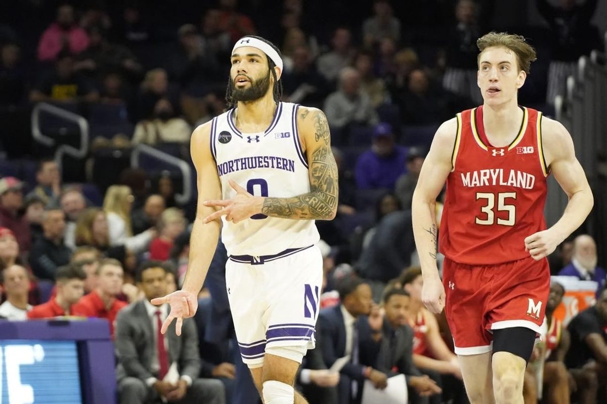 Jan 17, 2024; Evanston, Illinois, USA; Northwestern Wildcats guard Boo Buie (0) gestures after a three point basket against the Maryland Terrapins during the first half at Welsh-Ryan Arena.