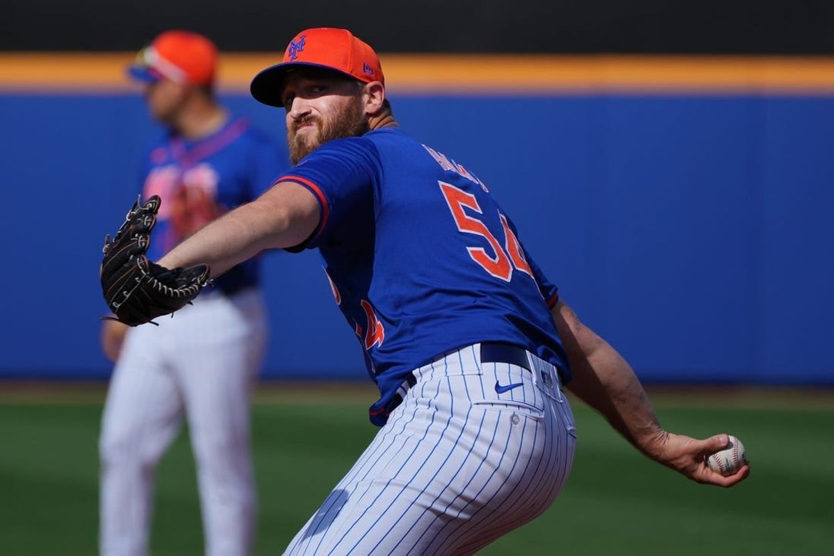 Mar 5, 2024; Port St. Lucie, Florida, USA;  New York Mets pitcher Austin Adams (54) warms-up in the seventh inning against the New York Yankees at Clover Park.