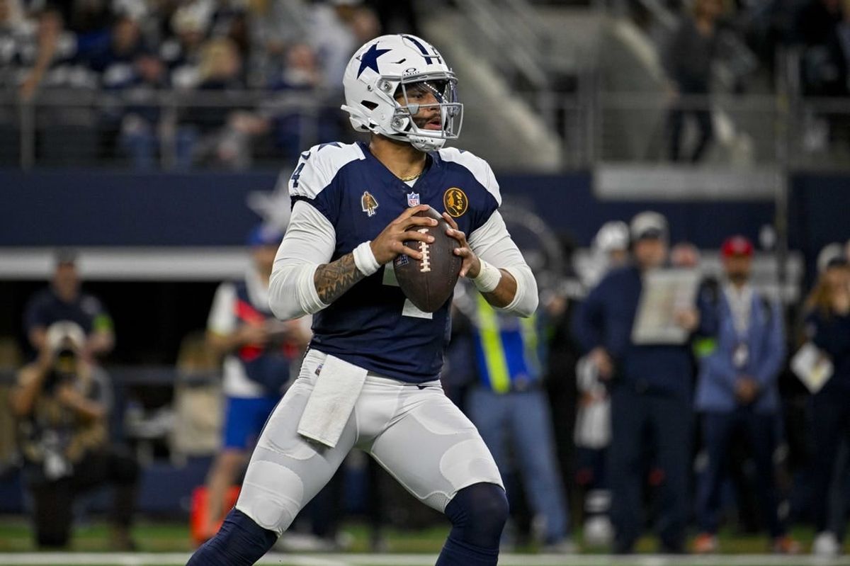 Nov 23, 2023; Arlington, Texas, USA; Dallas Cowboys quarterback Dak Prescott (4) in action during the game between the Dallas Cowboys and the Washington Commanders at AT&T Stadium.