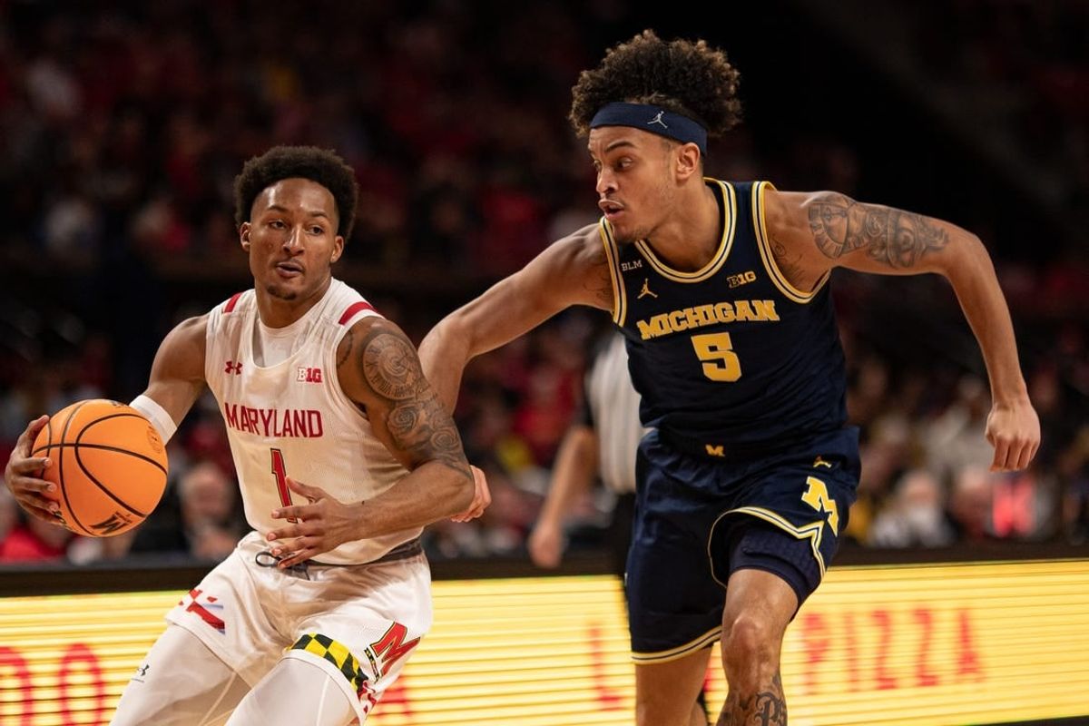 Jan 19, 2023; College Park, Maryland, USA;  Maryland Terrapins guard Jahmir Young (1) makes a move to the basket a Michigan Wolverines forward Terrance Williams II (5) defends during the second half at Xfinity Center.