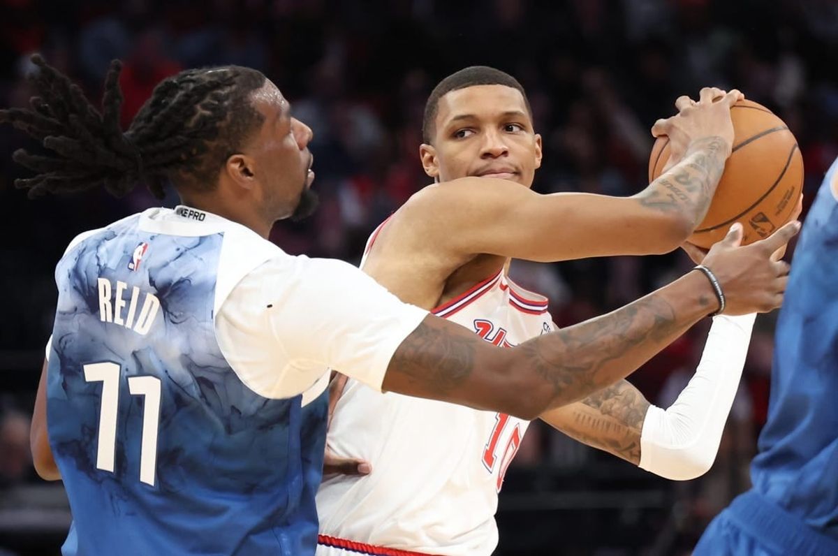 Jan 5, 2024; Houston, Texas, USA; Houston Rockets forward Jabari Smith Jr. (10) is defended by Minnesota Timberwolves center Naz Reid (11) in the second quarter at Toyota Center.