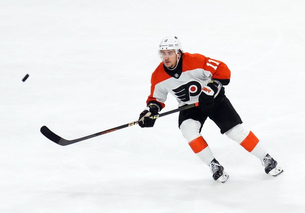 Dec 7, 2023; Tempe, Arizona, USA; Philadelphia Flyers right wing Travis Konecny (11) skates after a loose puck against the Arizona Coyotes during the third period at Mullett Arena.