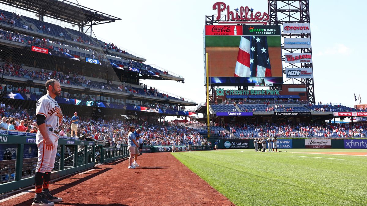 Giants’ manager Gabe Kapler stands for the national anthem on Memorial Day in Philly.