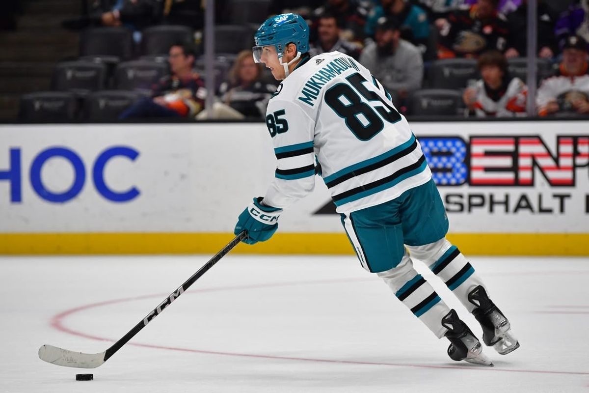 Jan 31, 2024; Anaheim, California, USA; San Jose Sharks defenseman Shakir Mukhamadullin (85) controls the puck against the Anaheim Ducks during the overtime period at Honda Center.