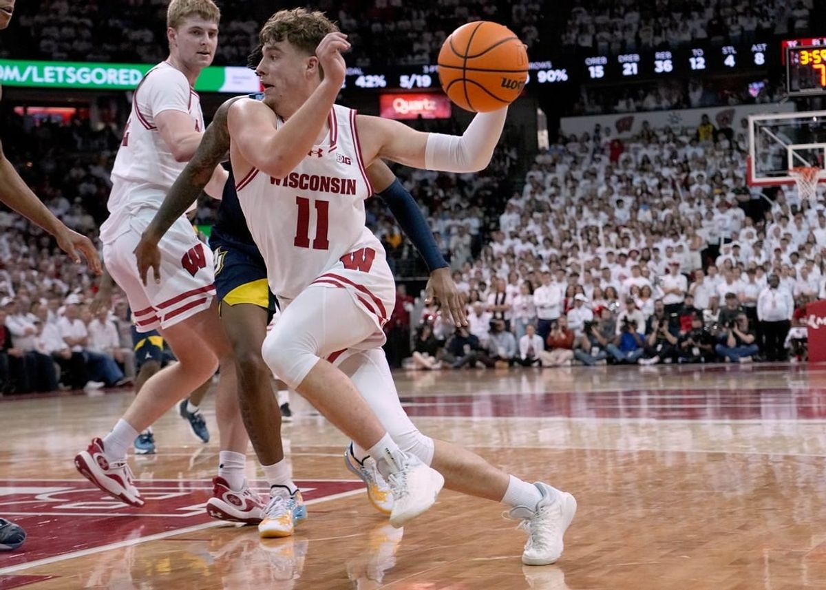 Dec 2, 2023; Madison, Wisconsin, USA; Wisconsin Badgers guard Max Klesmit (11) drives to the basket against the against Marquette Golden Eagles during the second half at the Kohl Center. Wisconsin won 75-64.
