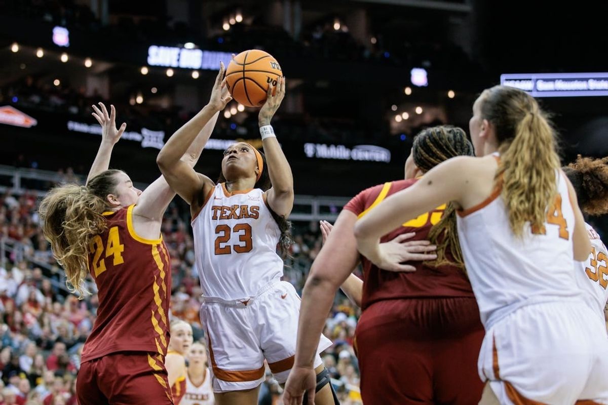 Mar 12, 2024; Kansas City, MO, USA; Texas Longhorns forward Aaliyah Moore (23) shoots the ball over Iowa State Cyclones forward Addy Brown (24) during the first half at T-Mobile Center.