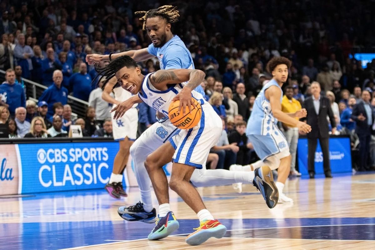 Dec 16, 2023; Atlanta, Georgia, USA; Kentucky Wildcats guard Rob Dillingham (0) dribbles the ball against North Carolina Tar Heels forward Jae'Lyn Withers (24) during the second half at State Farm Arena.