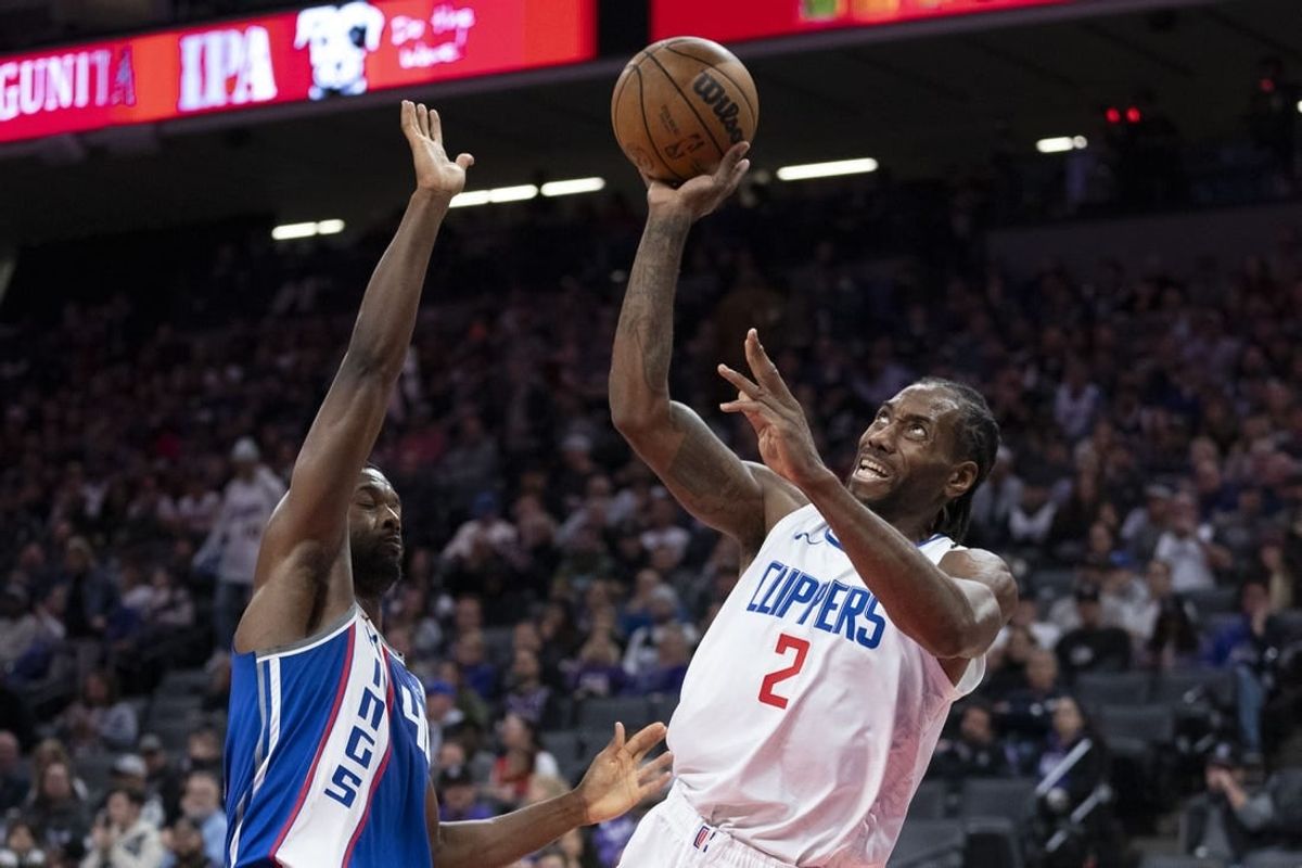 November 29, 2023; Sacramento, California, USA; LA Clippers forward Kawhi Leonard (2) shoots the basketball against Sacramento Kings forward Harrison Barnes (40) during the third quarter at Golden 1 Center.