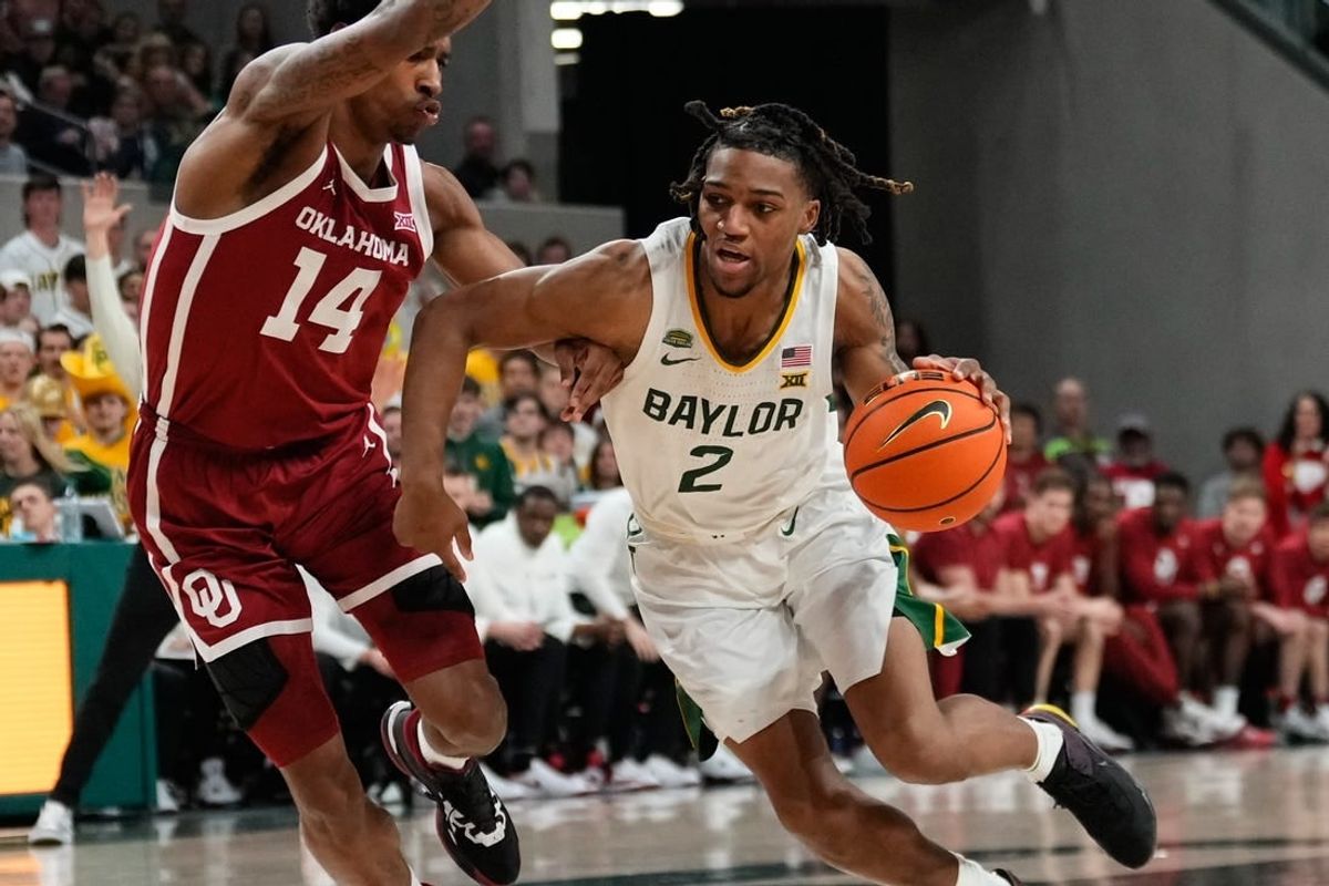 Feb 13, 2024; Waco, Texas, USA;  Baylor Bears guard Jayden Nunn (2) drives to the basket against Oklahoma Sooners forward Jalon Moore (14) during the second half at Paul and Alejandra Foster Pavilion.