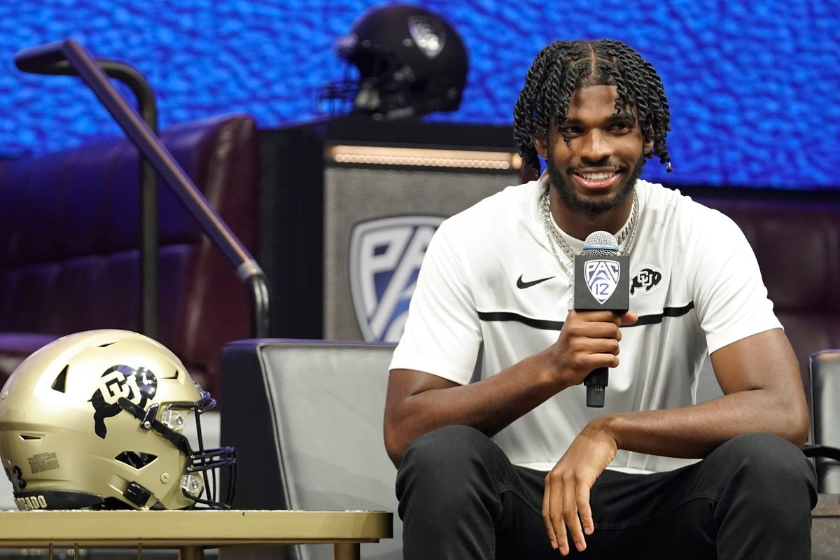 Colorado quarterback Shedeur Sanders speaks at an NCAA college football Pac-12 media day