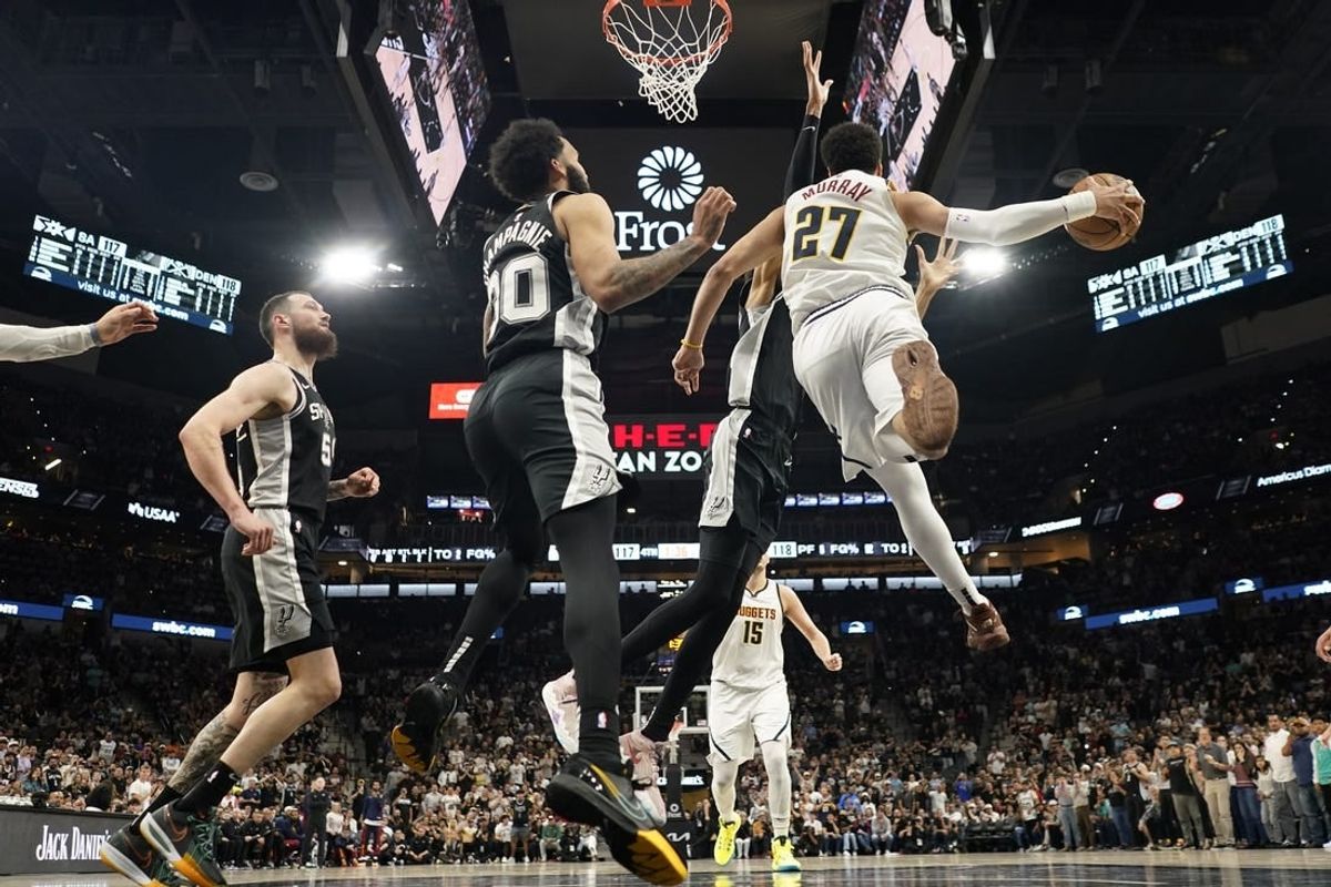 Apr 12, 2024; San Antonio, Texas, USA; Denver Nuggets guard Jamal Murray (27) passes the ball during the second half against the San Antonio Spurs at Frost Bank Center.