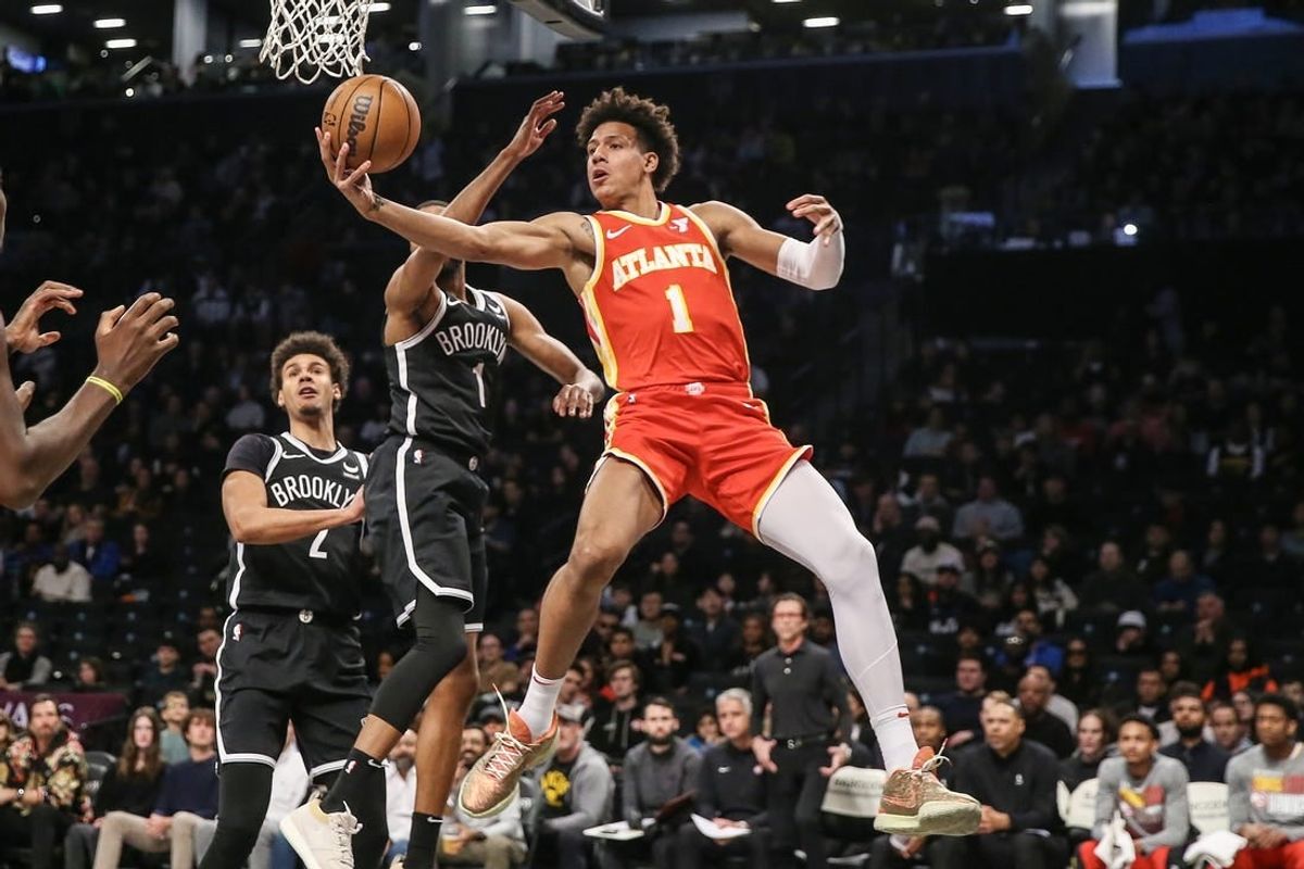 Mar 2, 2024; Brooklyn, New York, USA; Atlanta Hawks forward Jalen Johnson (1) drives past Brooklyn Nets forward Mikal Bridges (1) in the first quarter at Barclays Center.