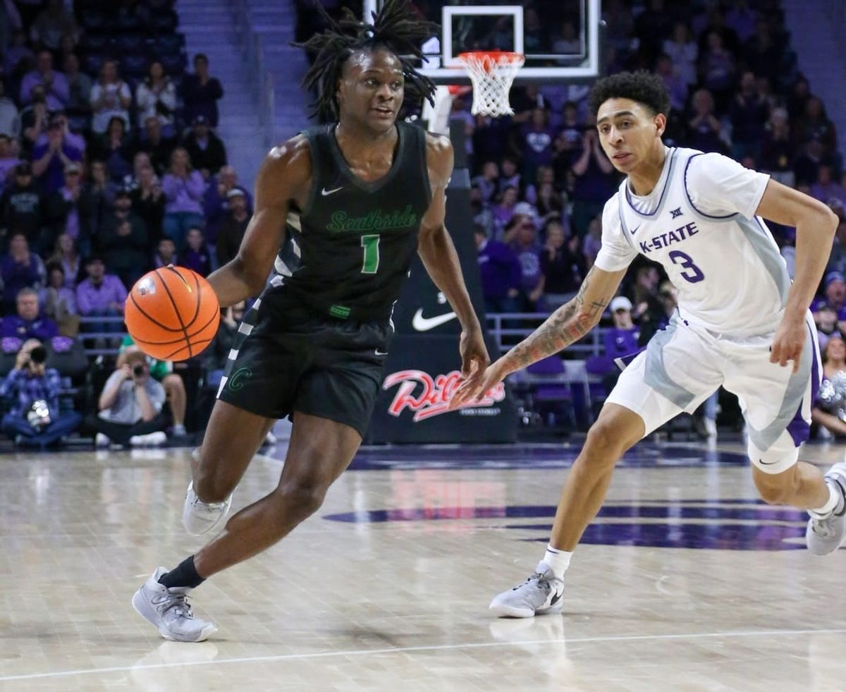 Jan 2, 2024; Manhattan, Kansas, USA; Chicago State Cougars guard Wesley Cardet, Jr.(1) dribbles by Kansas State Wildcats guard Dorian Finister (3) during the second half at Bramlage Coliseum.