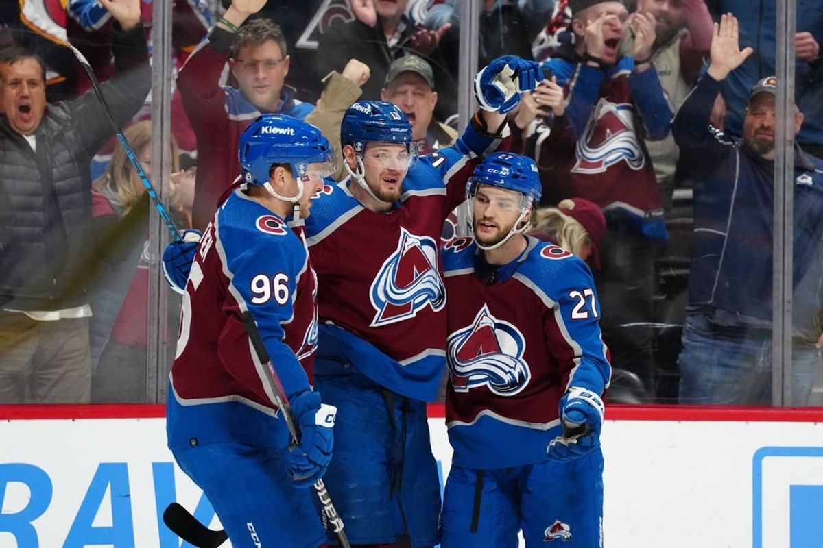 Jan 10, 2024; Denver, Colorado, USA; Colorado Avalanche right wing Valeri Nichushkin (13) celebrates his goal with right wing Mikko Rantanen (96) and left wing Jonathan Drouin (27) in the second period against the Vegas Golden Knights at Ball Arena.