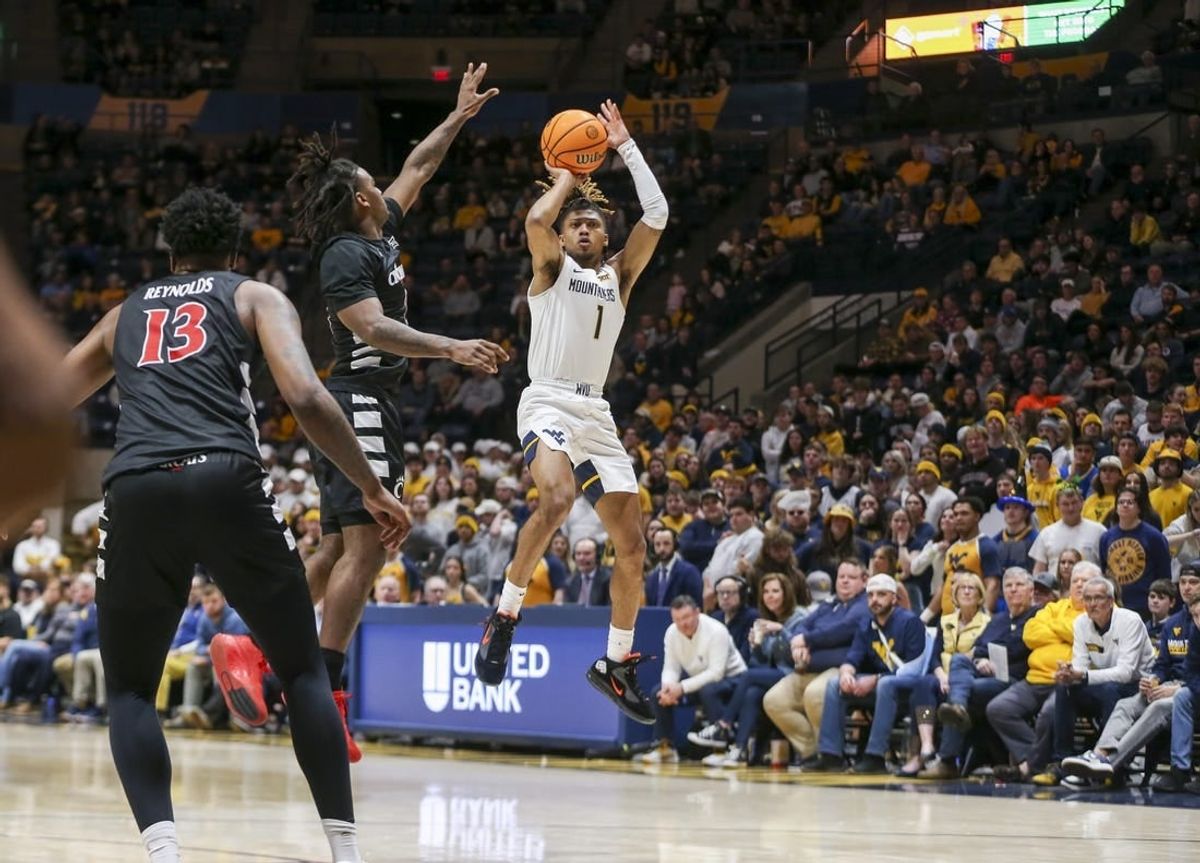 Jan 31, 2024; Morgantown, West Virginia, USA; West Virginia Mountaineers guard Noah Farrakhan (1) shoots a jumper during the second half against the Cincinnati Bearcats at WVU Coliseum.