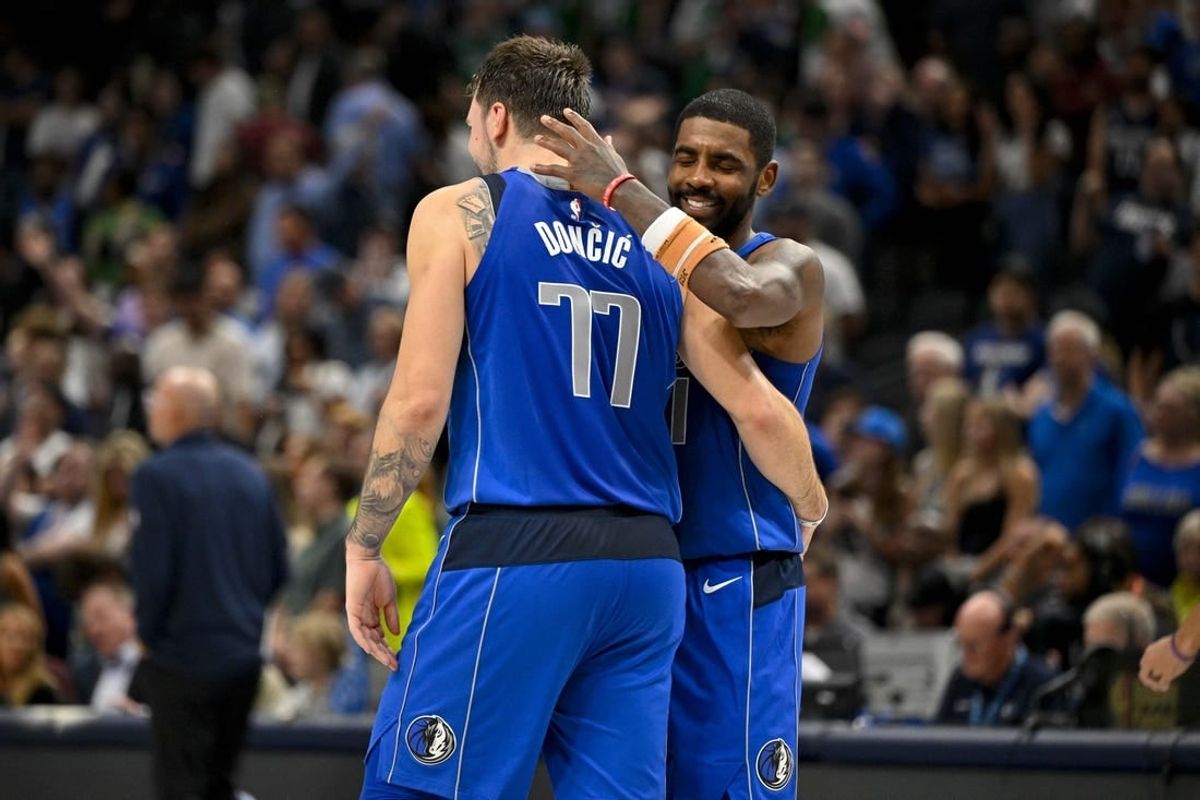 Nov 5, 2023; Dallas, Texas, USA; Dallas Mavericks guard Kyrie Irving (11) hugs guard Luka Doncic (77) during the second half against the Charlotte Hornets at the American Airlines Center.