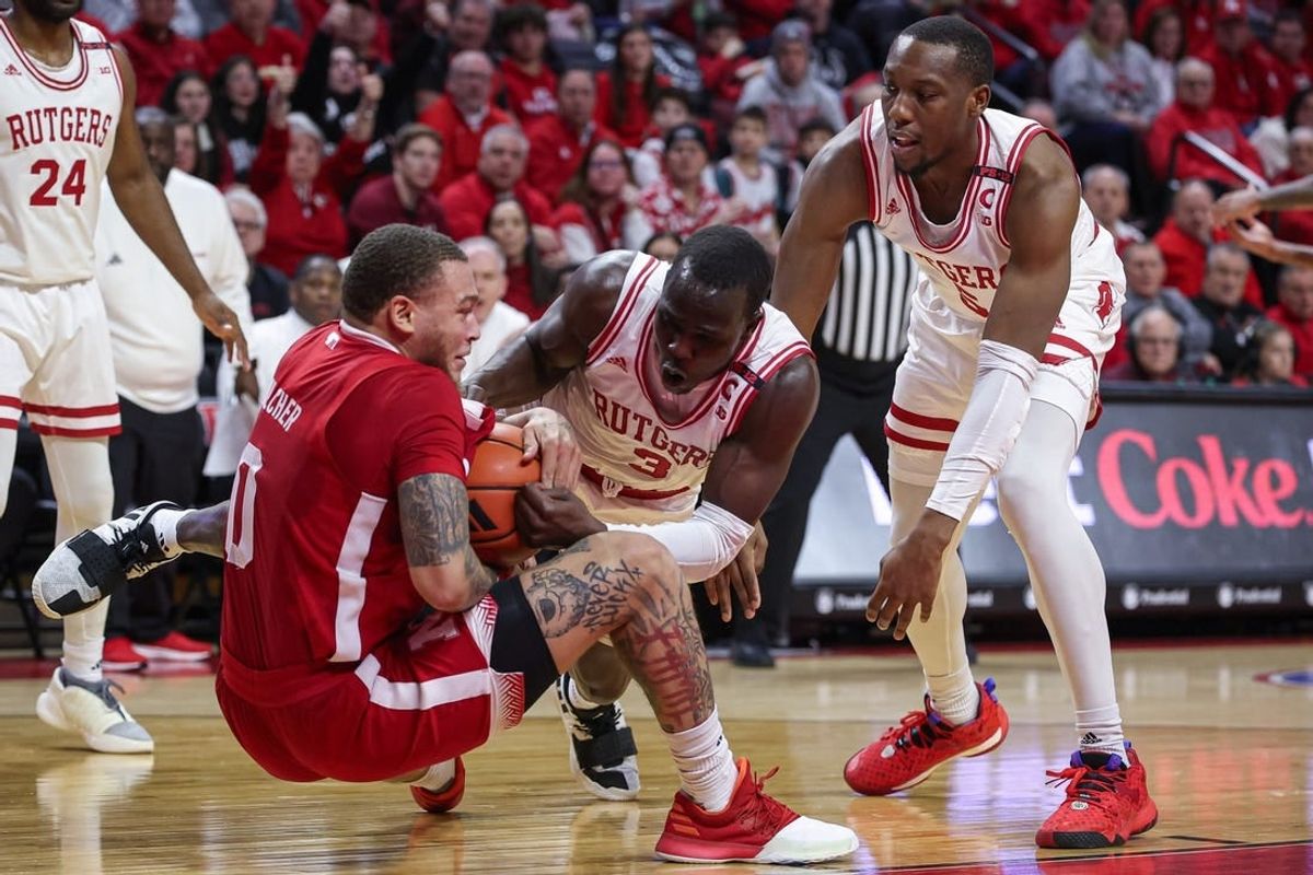 Jan 17, 2024; Piscataway, New Jersey, USA; Nebraska Cornhuskers guard C.J. Wilcher (0) and Rutgers Scarlet Knights forward Mawot Mag (3) battle for the ball in front of forward Aundre Hyatt (5) during the first half at Jersey Mike's Arena.