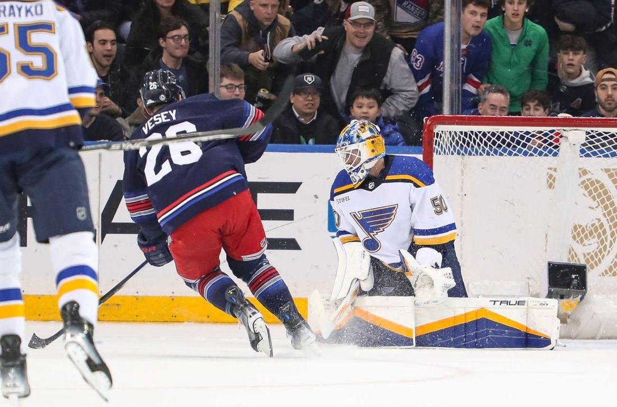 Mar 9, 2024; New York, New York, USA: New York Rangers left wing Jimmy Vesey (26) scores a goal on St. Louis Blues goalie Jordan Binnington (50) during the first period at Madison Square Garden.