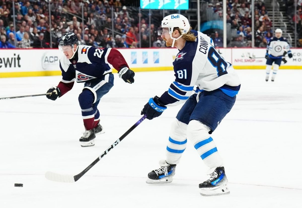 Dec 7, 2023; Denver, Colorado, USA; Winnipeg Jets left wing Kyle Connor (81) shoots the puck in the second period against the Colorado Avalanche at Ball Arena.