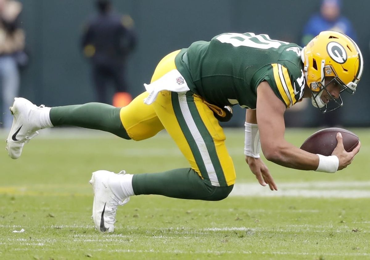Oct 29, 2023; Green Bay, Wisconsin, USA; Green Bay Packers quarterback Jordan Love (10) against the Minnesota Vikings during their football game at Lambeau Field.