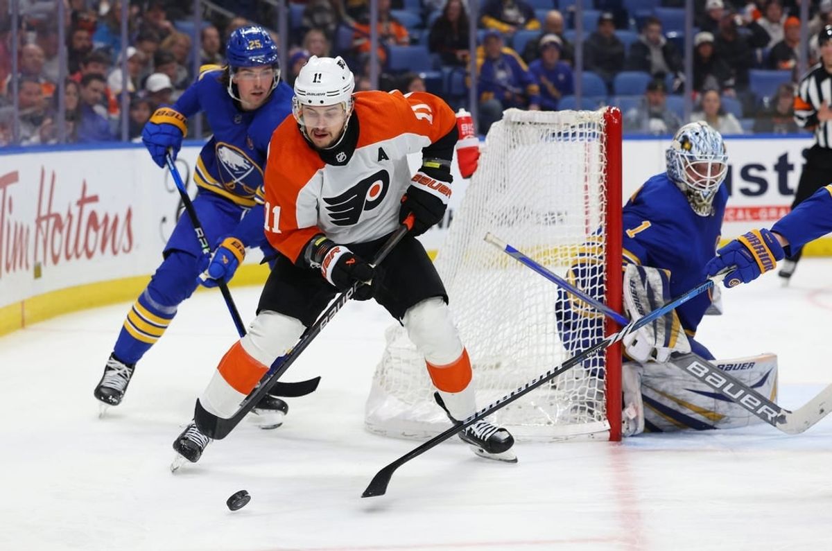Apr 5, 2024; Buffalo, New York, USA;  Buffalo Sabres defenseman Owen Power (25) defends as Philadelphia Flyers right wing Travis Konecny (11) looks to make a pass during the third period at KeyBank Center.