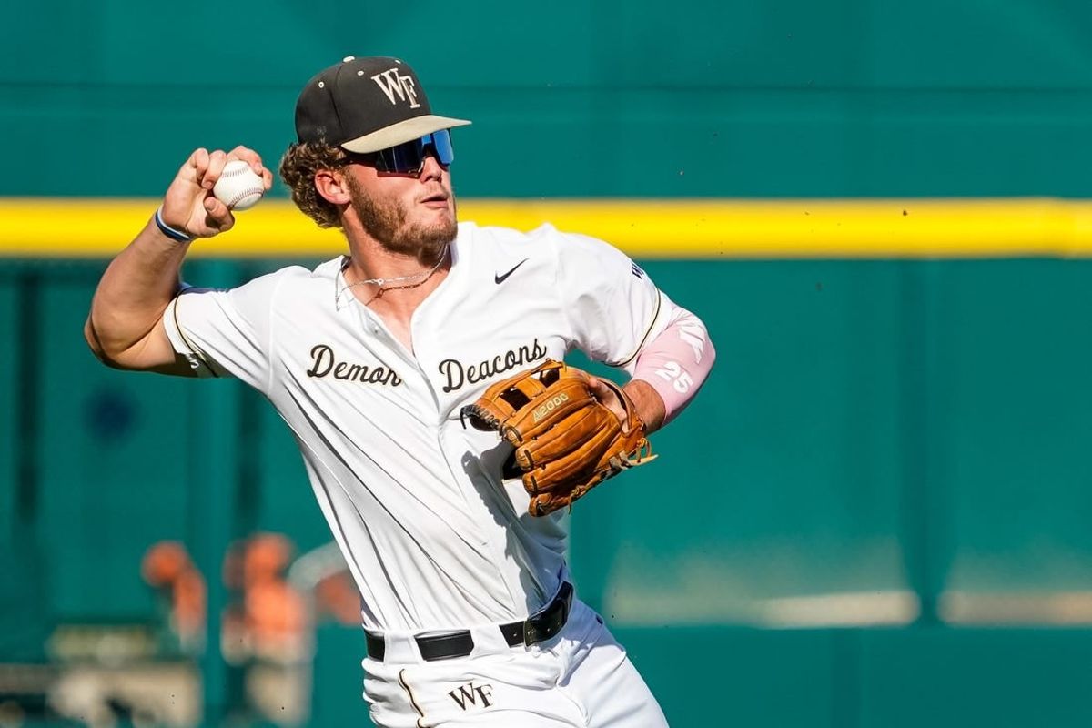 Jun 19, 2023; Omaha, NE, USA; Wake Forest Demon Deacons third baseman Brock Wilken (25) throws to get an out against the LSU Tigers during the first inning at Charles Schwab Field Omaha.
