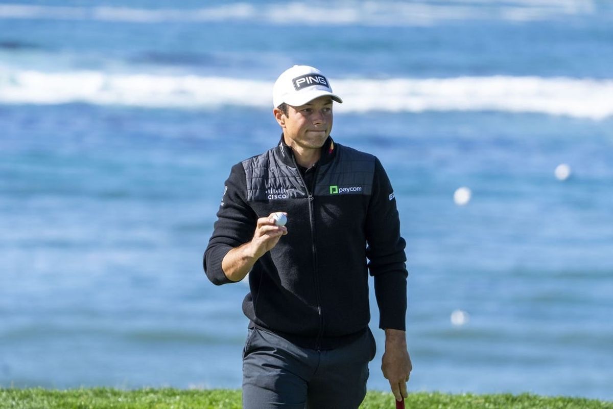 February 2, 2024; Pebble Beach, California, USA; Viktor Hovland acknowledges the crowd after making his putt on the fifth hole during the second round of the AT&T Pebble Beach Pro-Am golf tournament at Pebble Beach Golf Links.