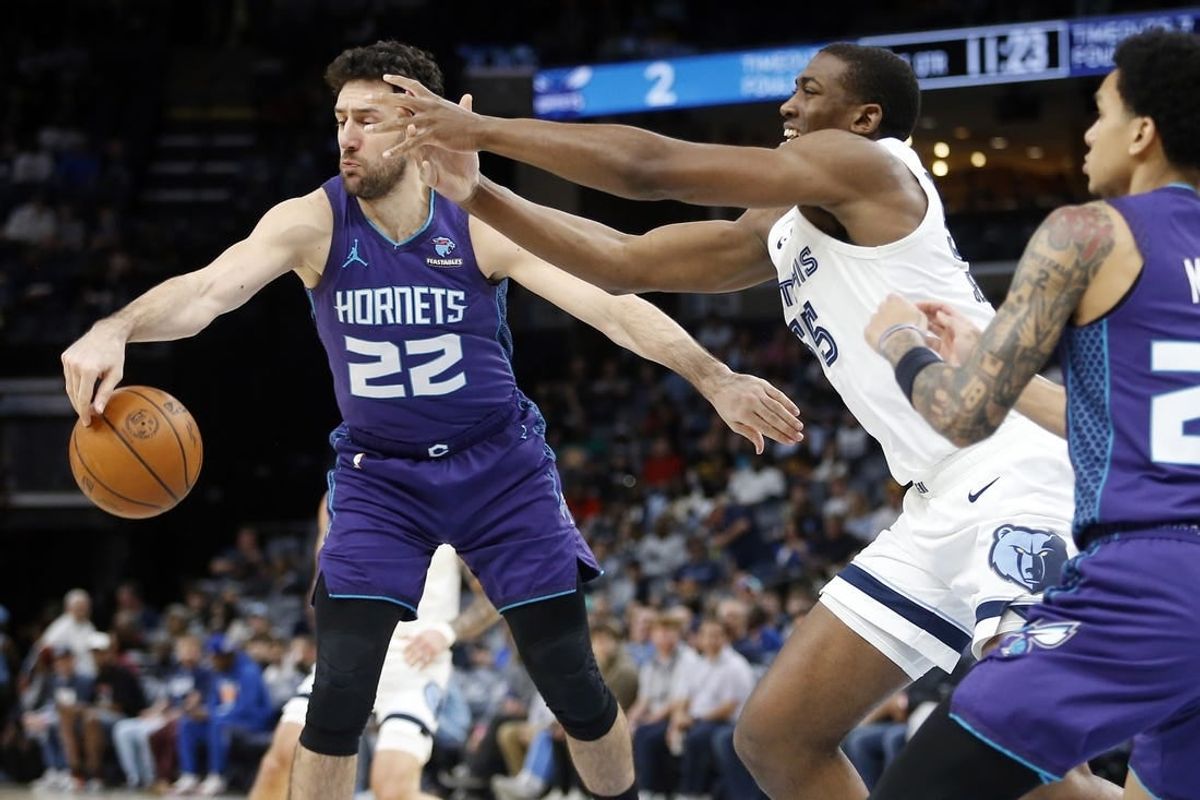 Mar 12, 2024; Memphis, Tennessee, USA; Charlotte Hornets guard Vasilije Micic (22) and Memphis Grizzlies center Trey Jemison (55) battle for a rebound during the first half at FedExForum.