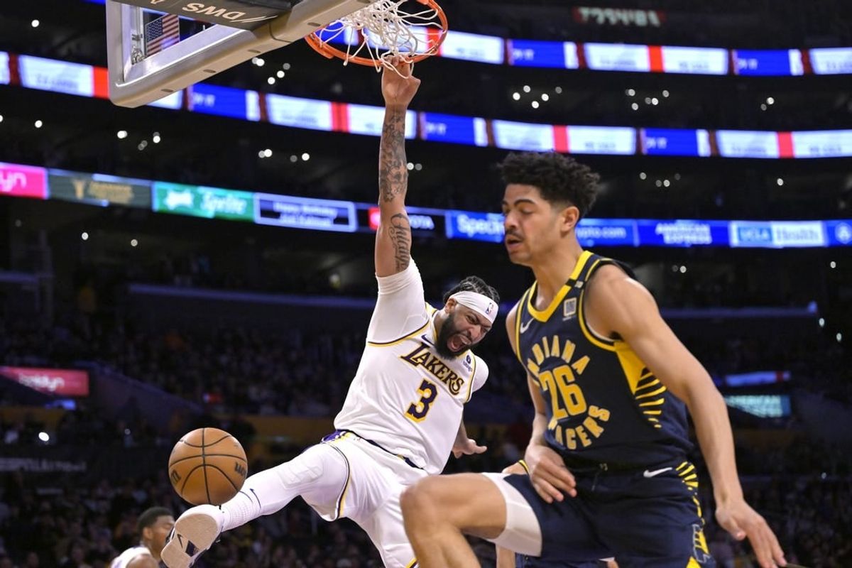 Mar 24, 2024; Los Angeles, California, USA;   Los Angeles Lakers forward Anthony Davis (3) reacts after he gets past Indiana Pacers guard Ben Sheppard (26) for a dunk in the second half at Crypto.com Arena.