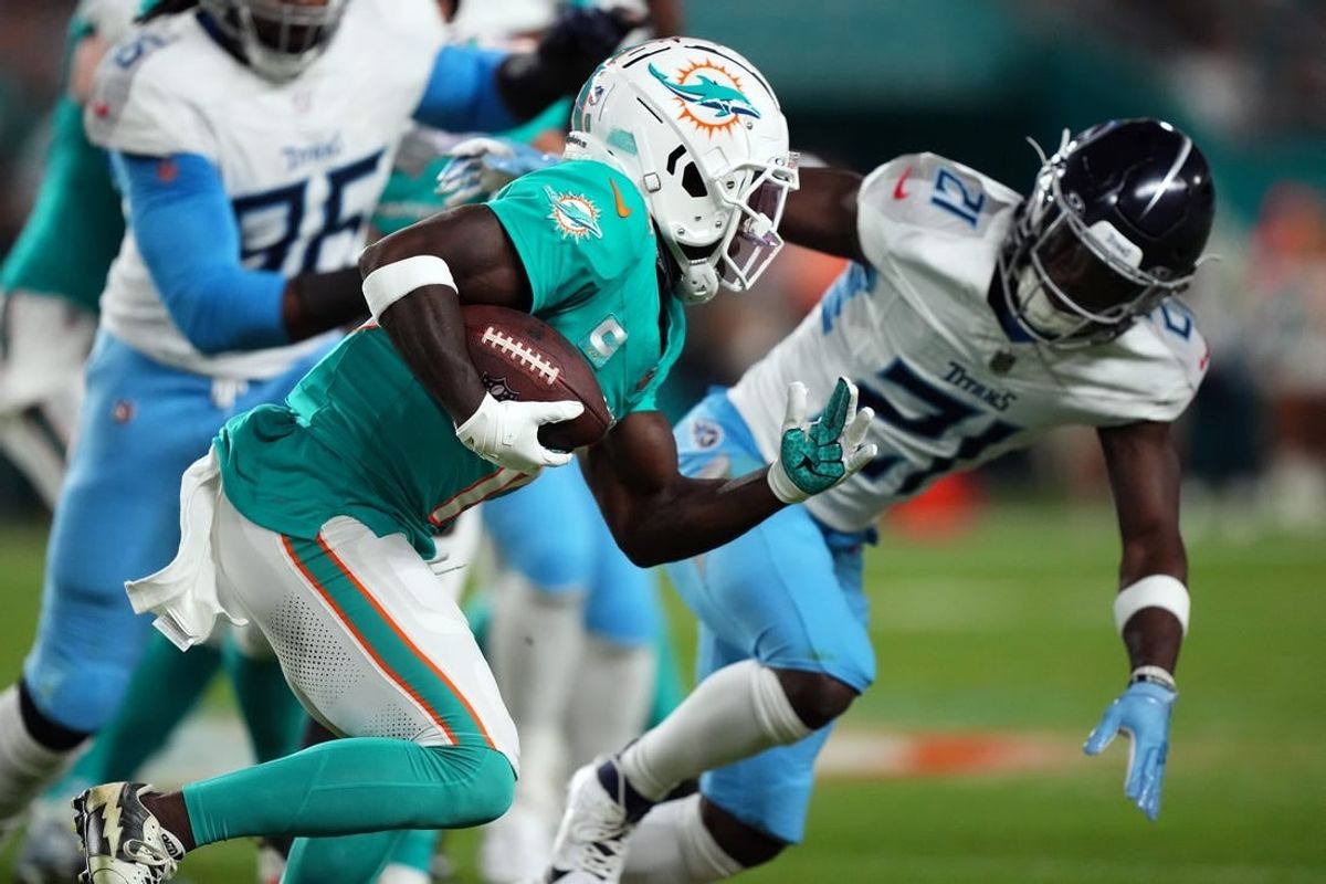 Dec 11, 2023; Miami Gardens, Florida, USA; Miami Dolphins wide receiver Tyreek Hill (10) runs with the ball against the Tennessee Titans during the first half at Hard Rock Stadium.