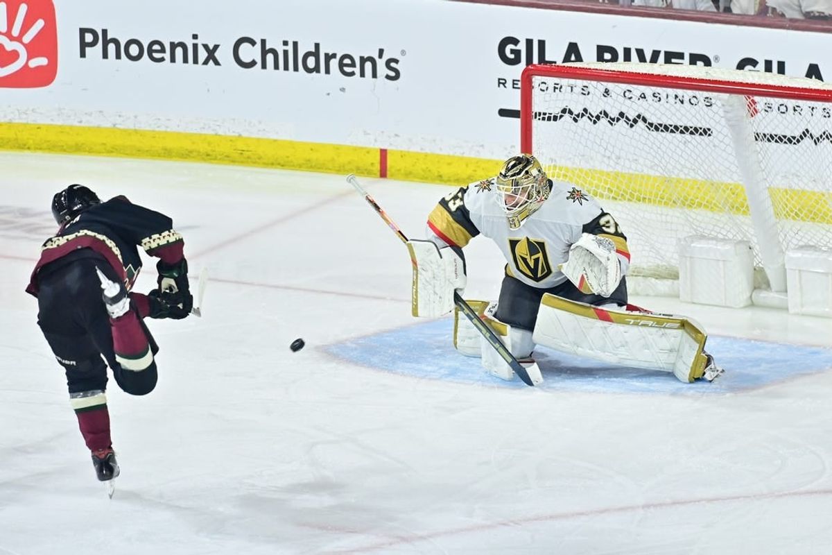 Feb 8, 2024; Tempe, Arizona, USA; Arizona Coyotes right wing Clayton Keller (9) scores on Vegas Golden Knights goaltender Adin Hill (33) in the third period at Mullett Arena.