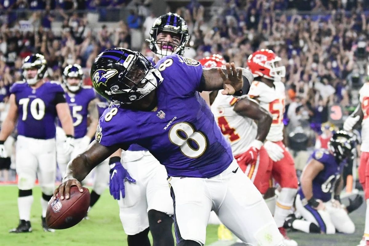 Sep 19, 2021; Baltimore, Maryland, USA;  Baltimore Ravens quarterback Lamar Jackson (8) celebrates scoring a fourth quarter touchdown  against the Kansas City Chiefs at M&T Bank Stadium.