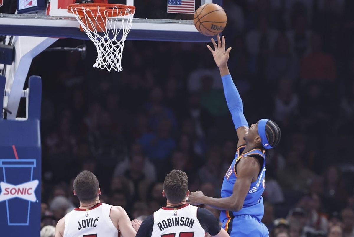 Mar 8, 2024; Oklahoma City, Oklahoma, USA; Oklahoma City Thunder guard Shai Gilgeous-Alexander (2) lays up a shot in front of Miami Heat forward Duncan Robinson (55) during the first quarter at Paycom Center.