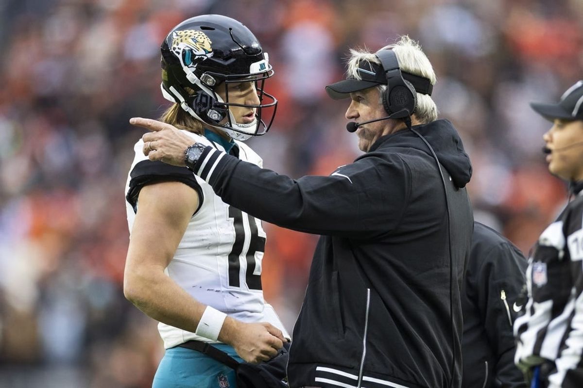 Dec 10, 2023; Cleveland, Ohio, USA; Jacksonville Jaguars head coach Doug Pederson talks with quarterback Trevor Lawrence (16) during the third quarter against the Cleveland Browns at Cleveland Browns Stadium.
